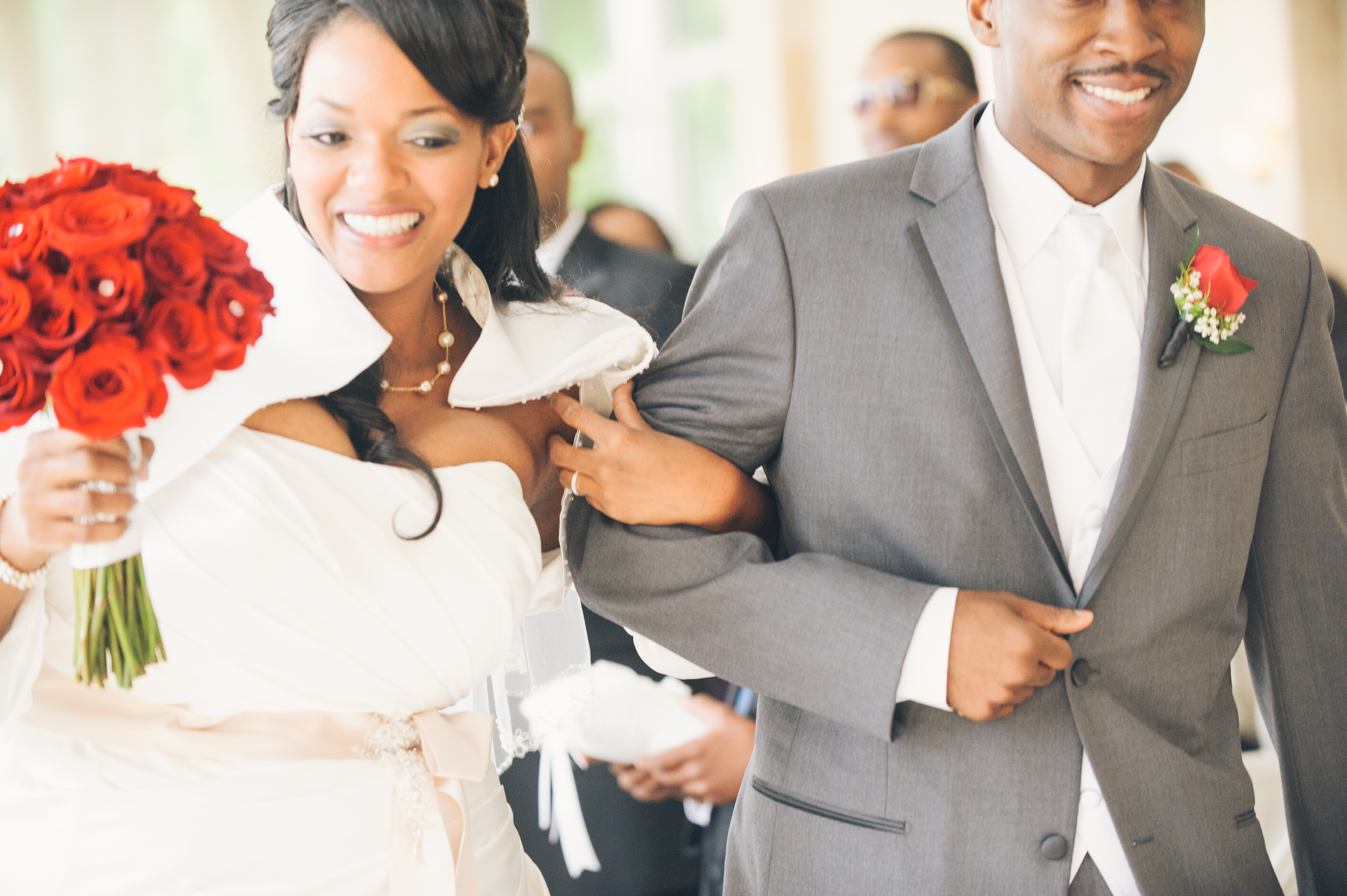 African American bride and groom happily walking back down the aisle after their Atlanta wedding at the Piedmont Room