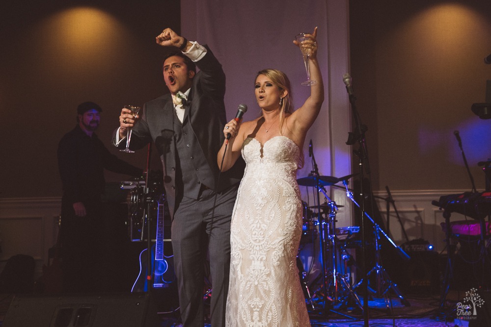 Bride and groom calling the Dawgs with UGA cheer.