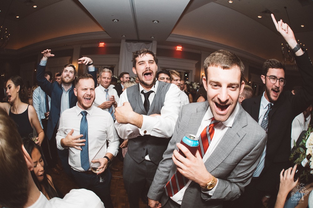 Groomsmen singing at top of their lungs.