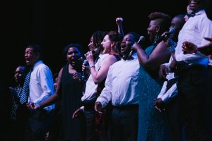 Covenant House GA youth singing with Broadway Stars on Coca Cola Roxie stage