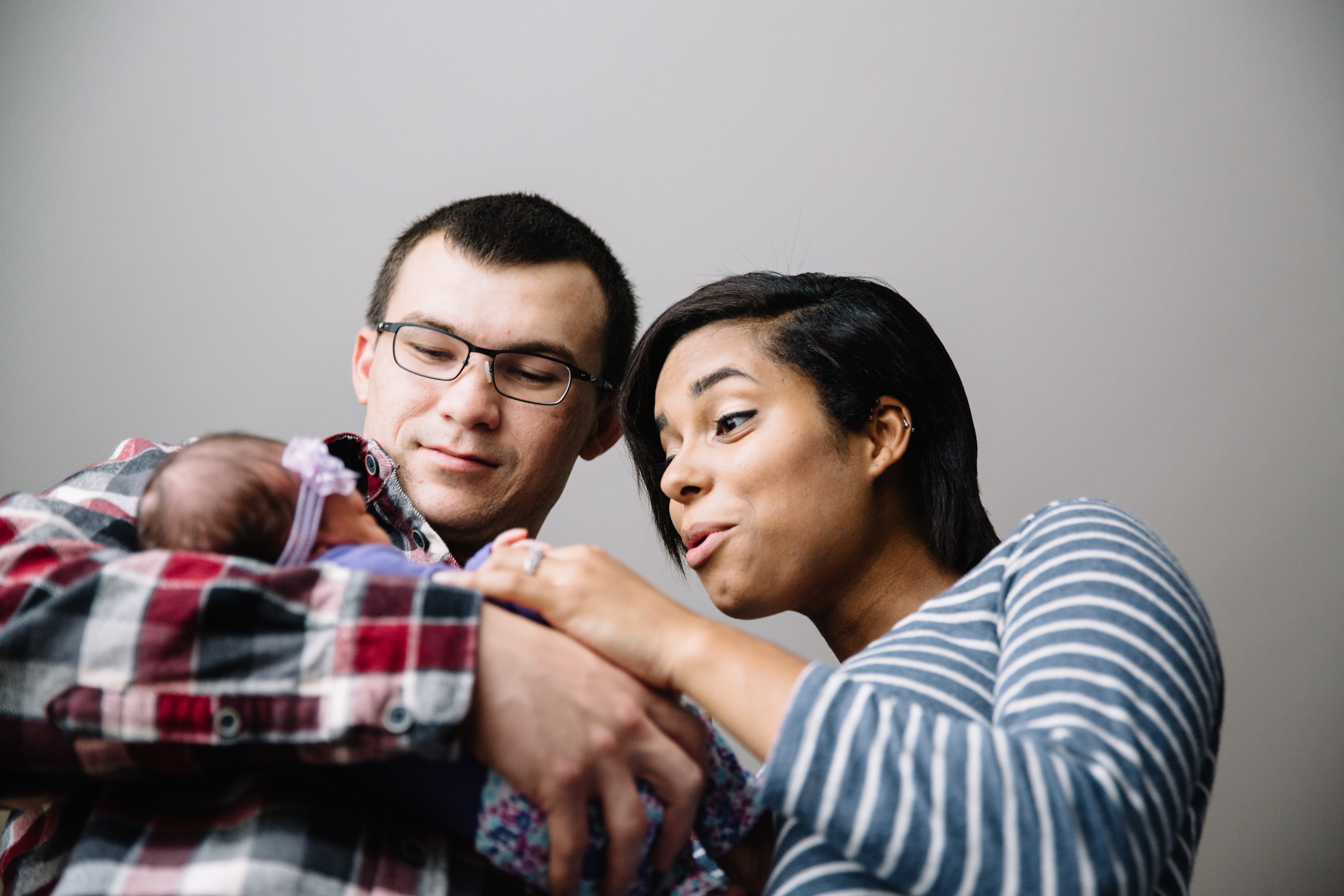 Inter-racial parents Oooohing over their newborn baby girl