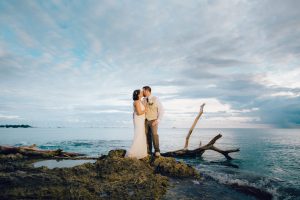 Bride + Groom kissing on Dominican Republic beach for their destination wedding photographer