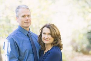 Smiling couple in blue shirts