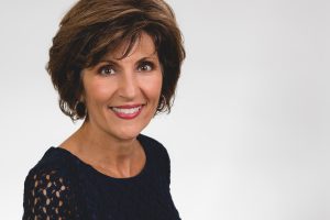 Smiling brunette woman in black shirt