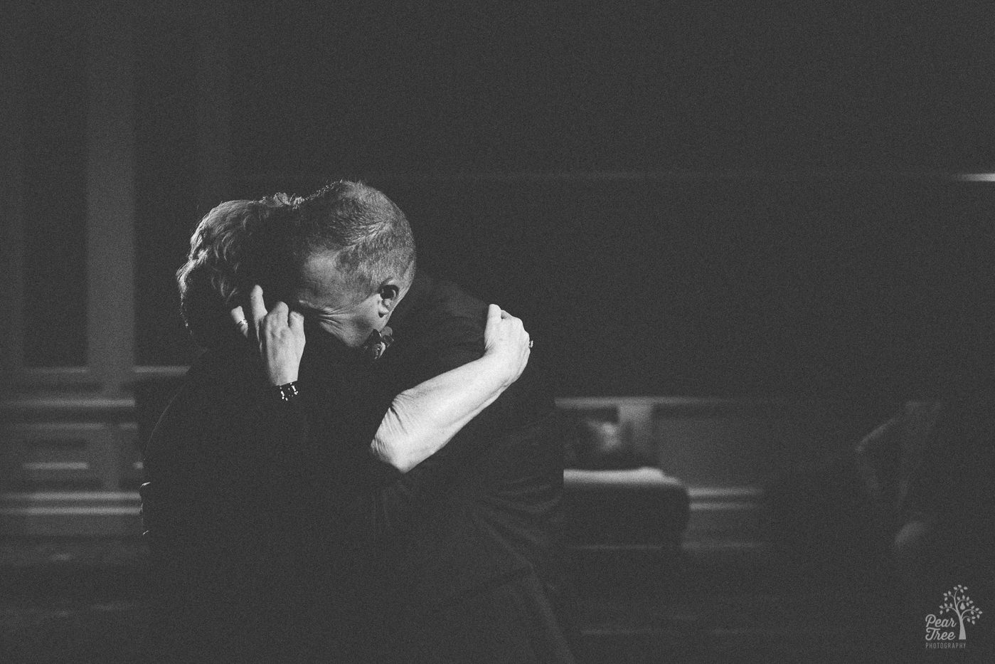 Groom hugging his mom tight during Mother-Son dance.