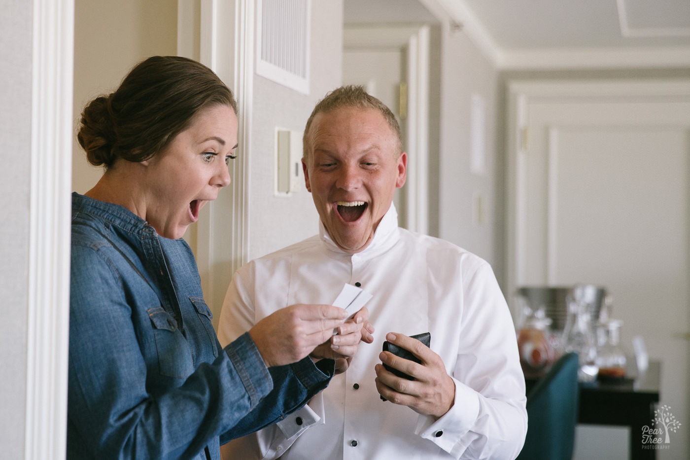 Excitement and surprise on groom's face as he shows his maid-of-honor Celine Dion show tickets.