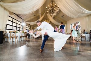 Bride and groom dancing with dramatic dip inside the Greystone Estate in Ballground, GA