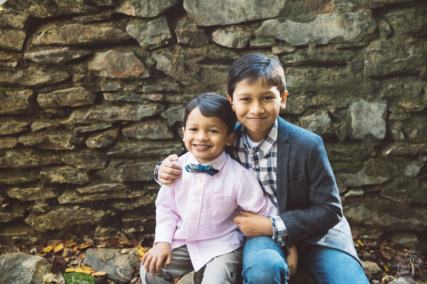 Two brothers holding each other close at Sope Creek mill ruins.