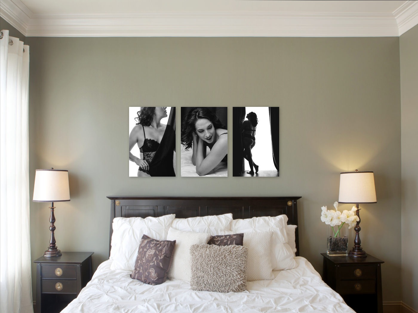 Black & white boudoir images on display as fine art on metals over master bedroom bed
