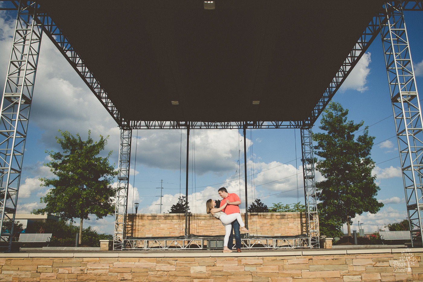 Married couple dancing on City Springs amphitheatre stage