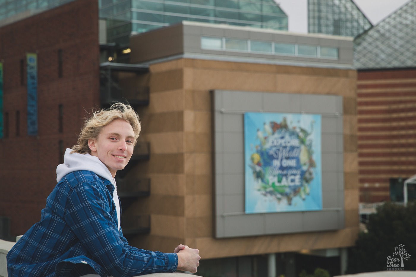 Smiling blond man in front of Tennessee Aquarium