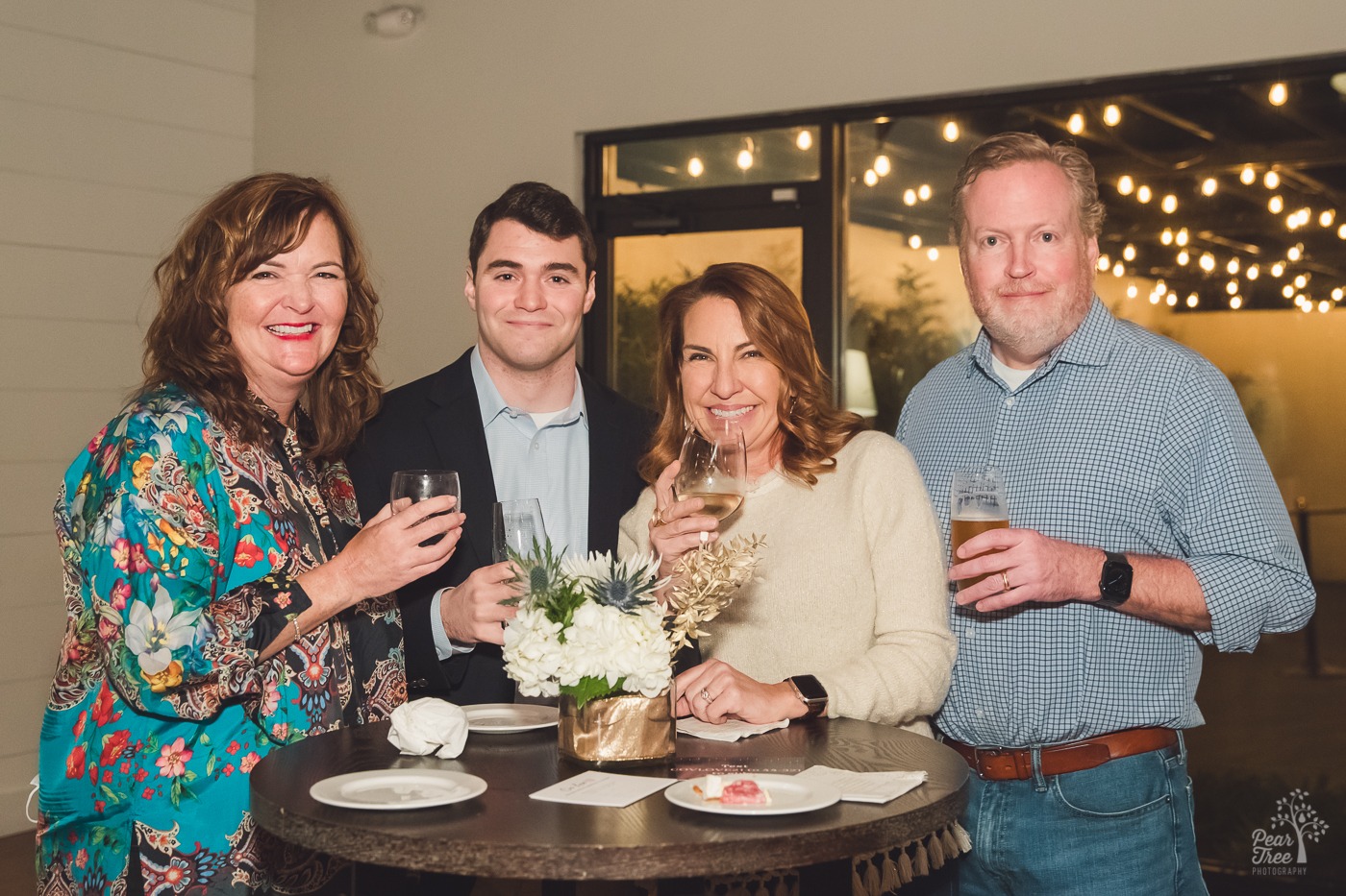 Smiling guest Kimberly Euston and friends having drinks at the Carlyle before the Yacht Rock Review Band performance for Covenant House Georgia patrons.