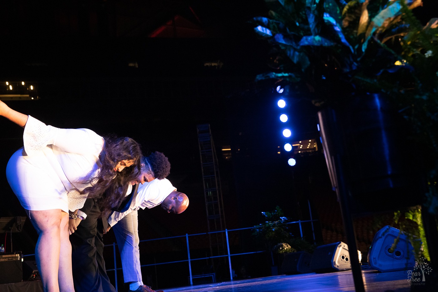 Covenant House Georgia youth bowing with a broadway performer on stage at Mercedes Benz stadium during Night of Broadway Stars 2021