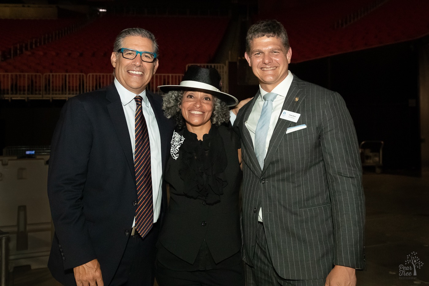 Ben Deutsch, Dr. Alie Redd, and Clark Dean standing close and smiling. After Night of Broadway Stars event for Covenant House Georgia inside Atlanta's Mercedes Benz stadium