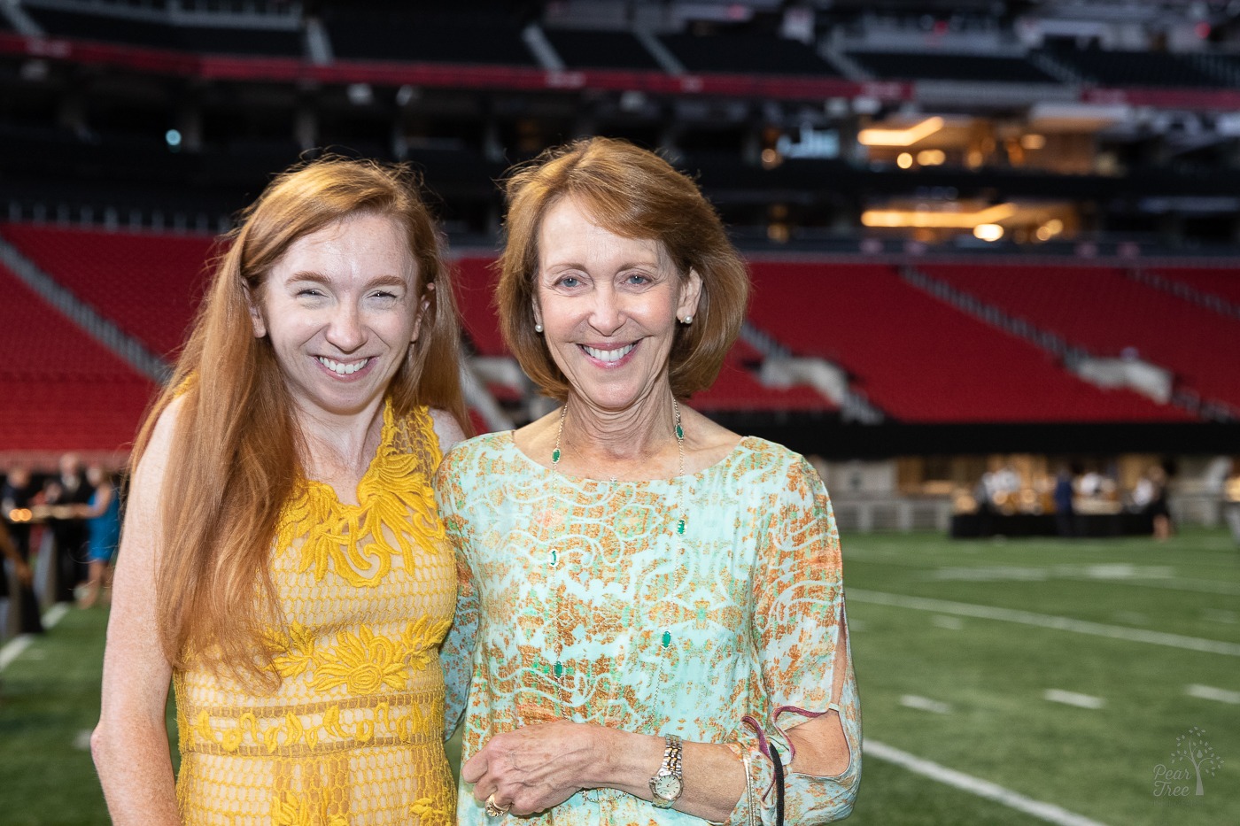 Mother/daughter smiling inside the Atlanta Mercedes Benz stadium before the Night of Broadway Stars hosted by Covenant House Georgia