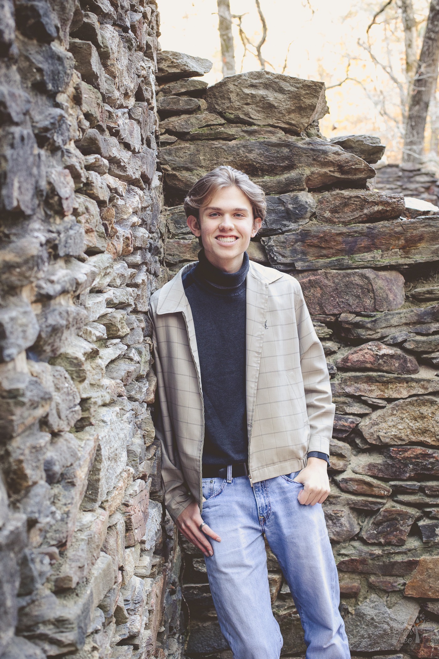 Handsome teenage boy standing against Sope Creek paper mill ruins