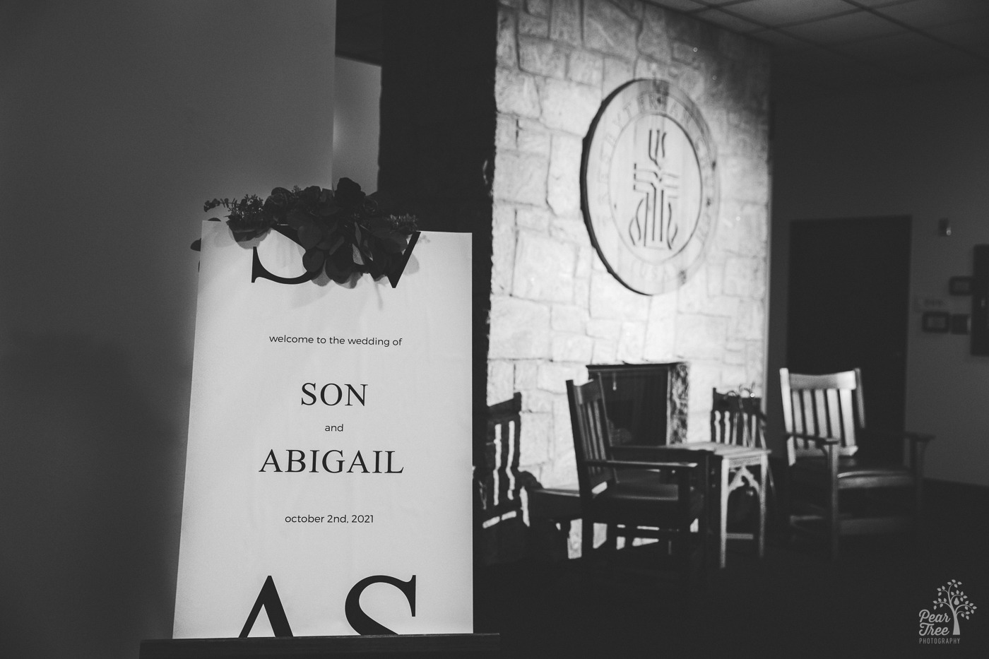 Black and white photograph of signboard for Abigail and Son's wedding day in Atlanta