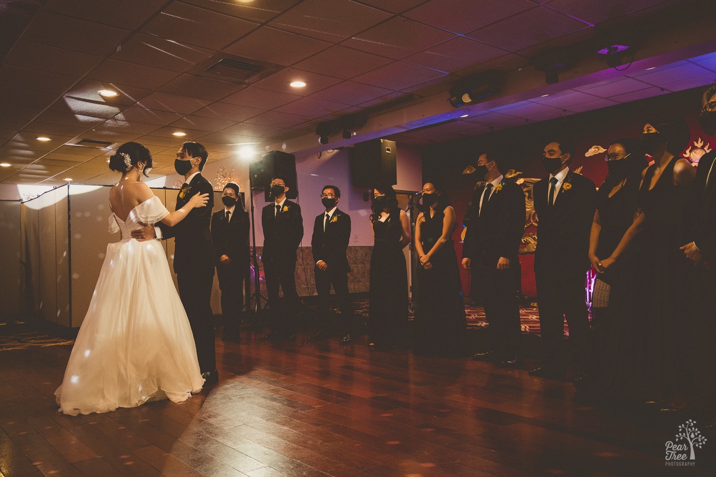 Asian bride and groom dancing in front of their wedding party at Canton House