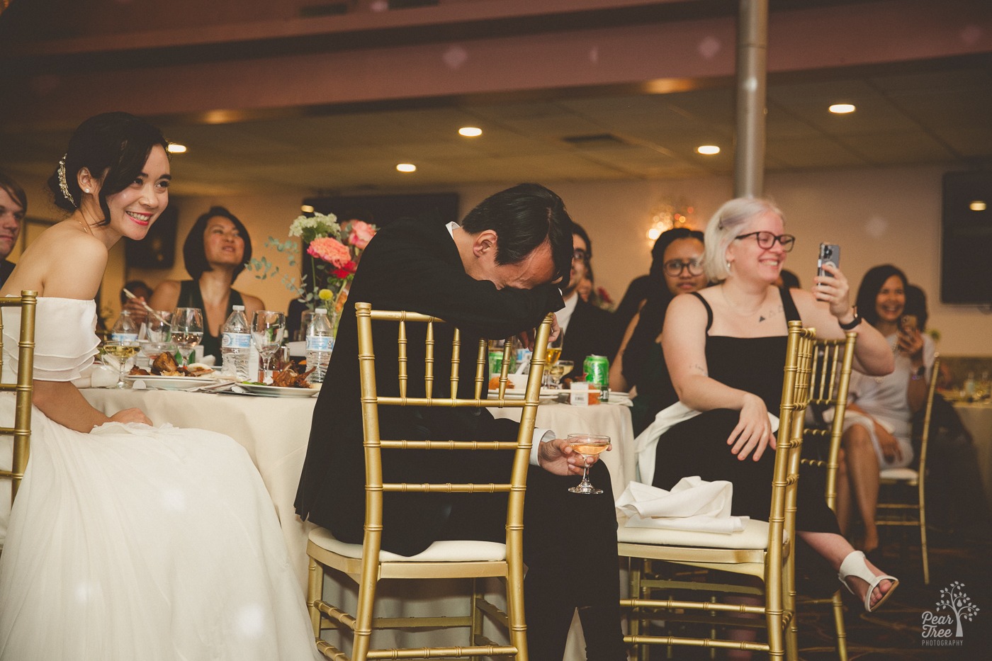 Laughing Asian groom and bride