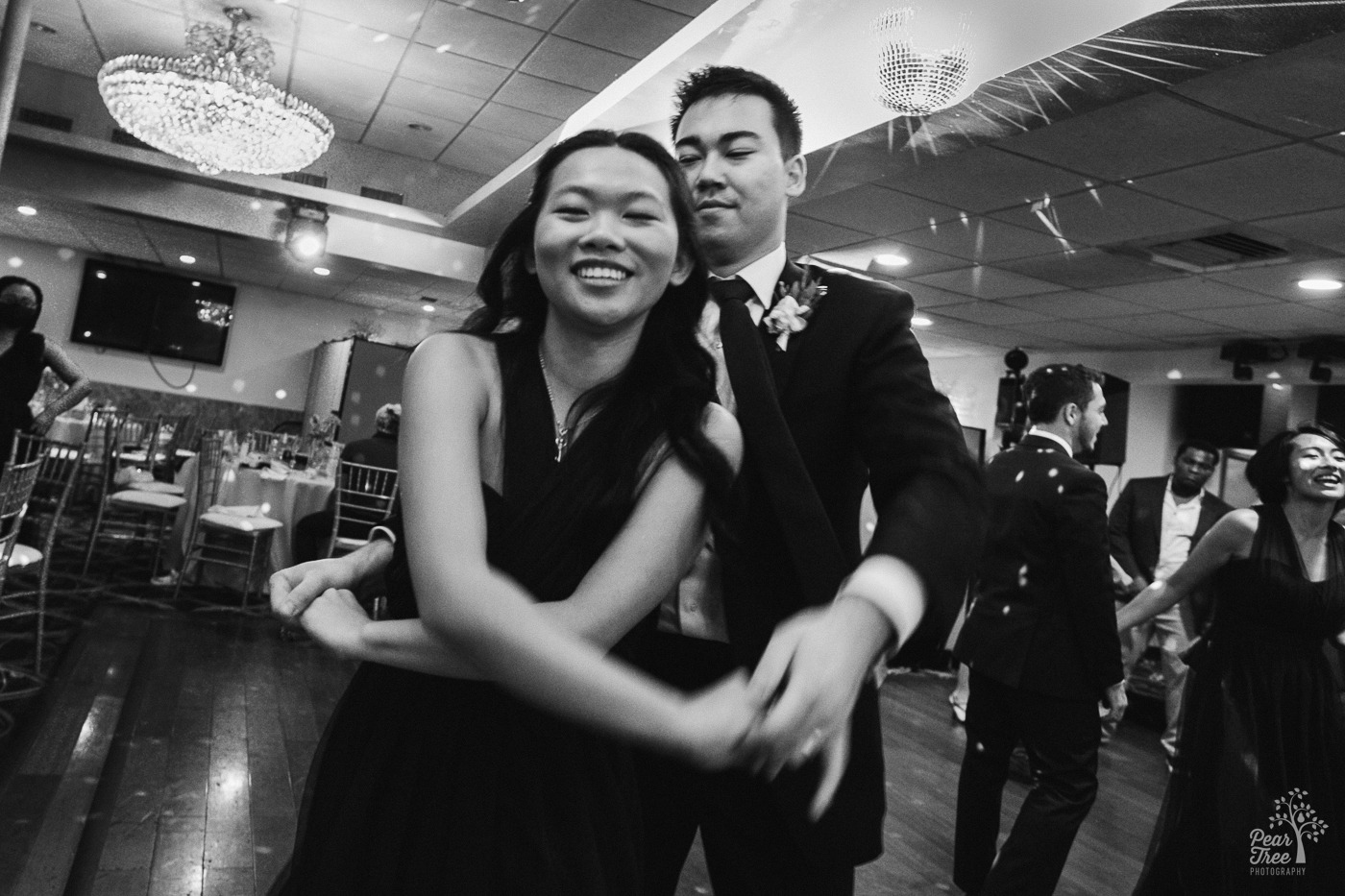 Black and white photo of Asian couple dancing at a wedding in Atlanta