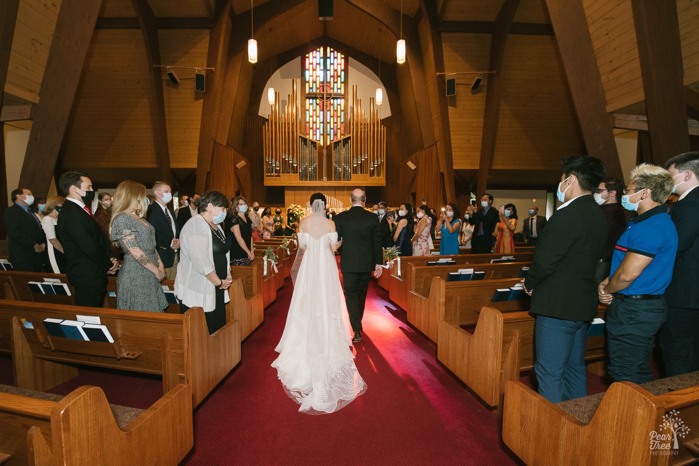 Looking into Eastminster Presbyterian Church sanctuary as father walks his bride daughter down the aisle