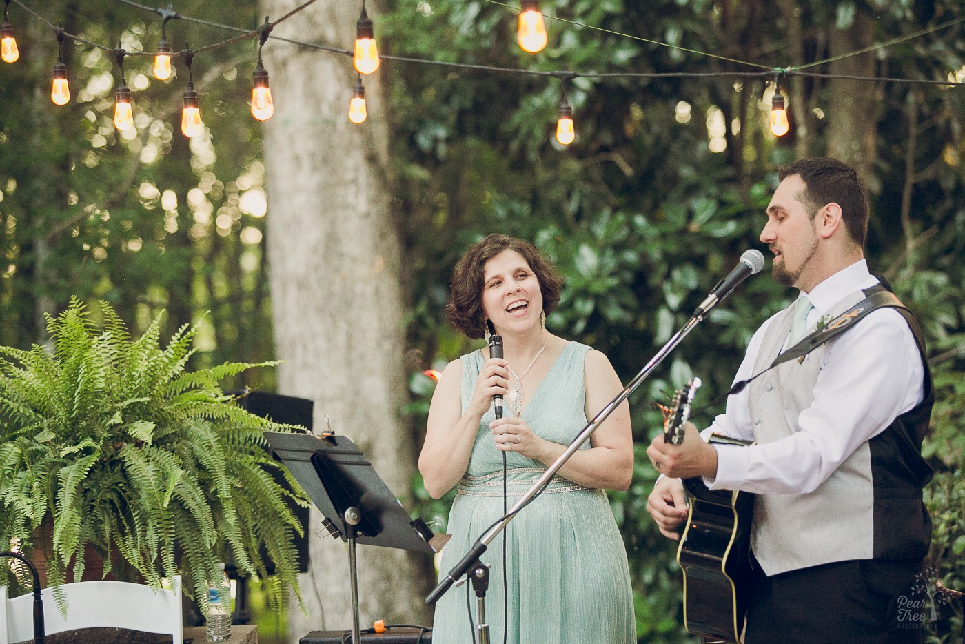 Bride and groom singing during their wedding ceremony