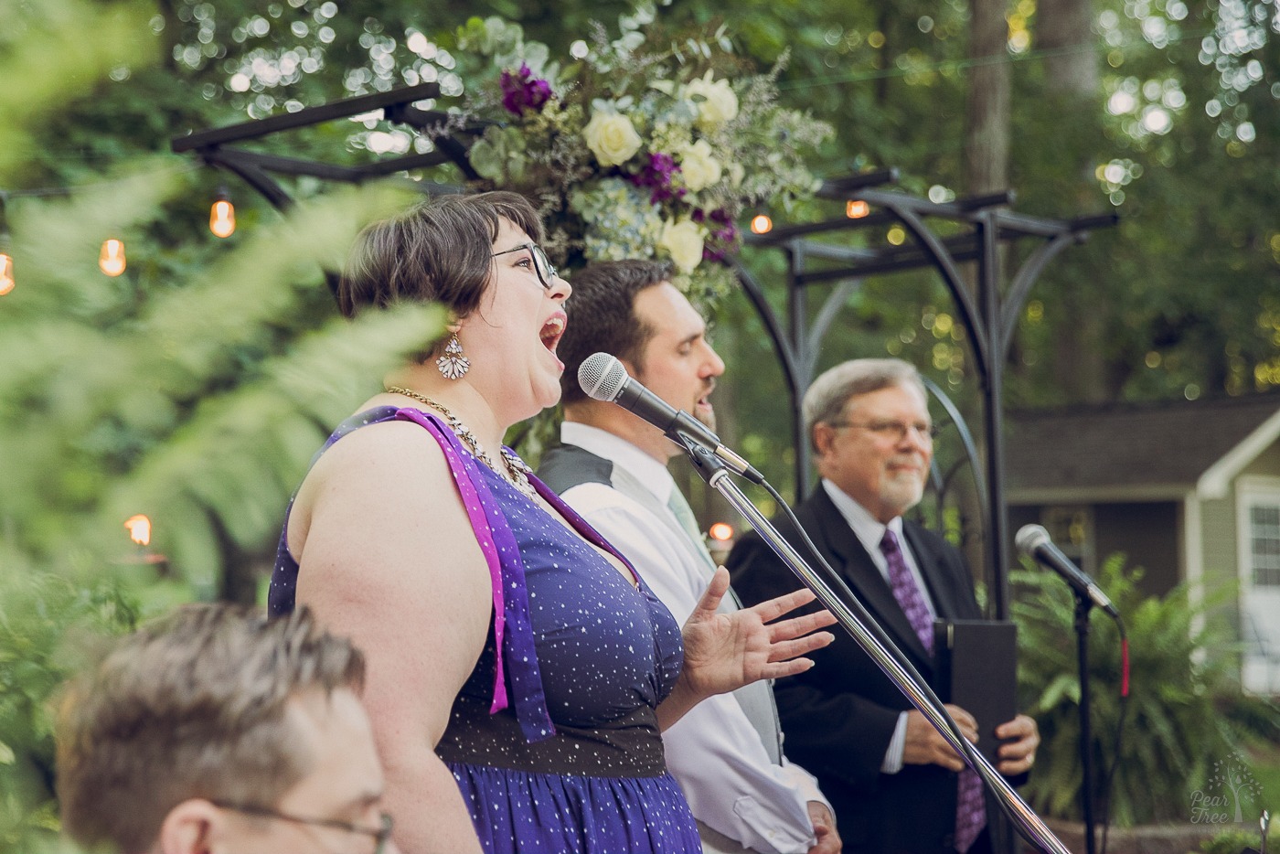 Groom and his sister singing at start of wedding ceremony