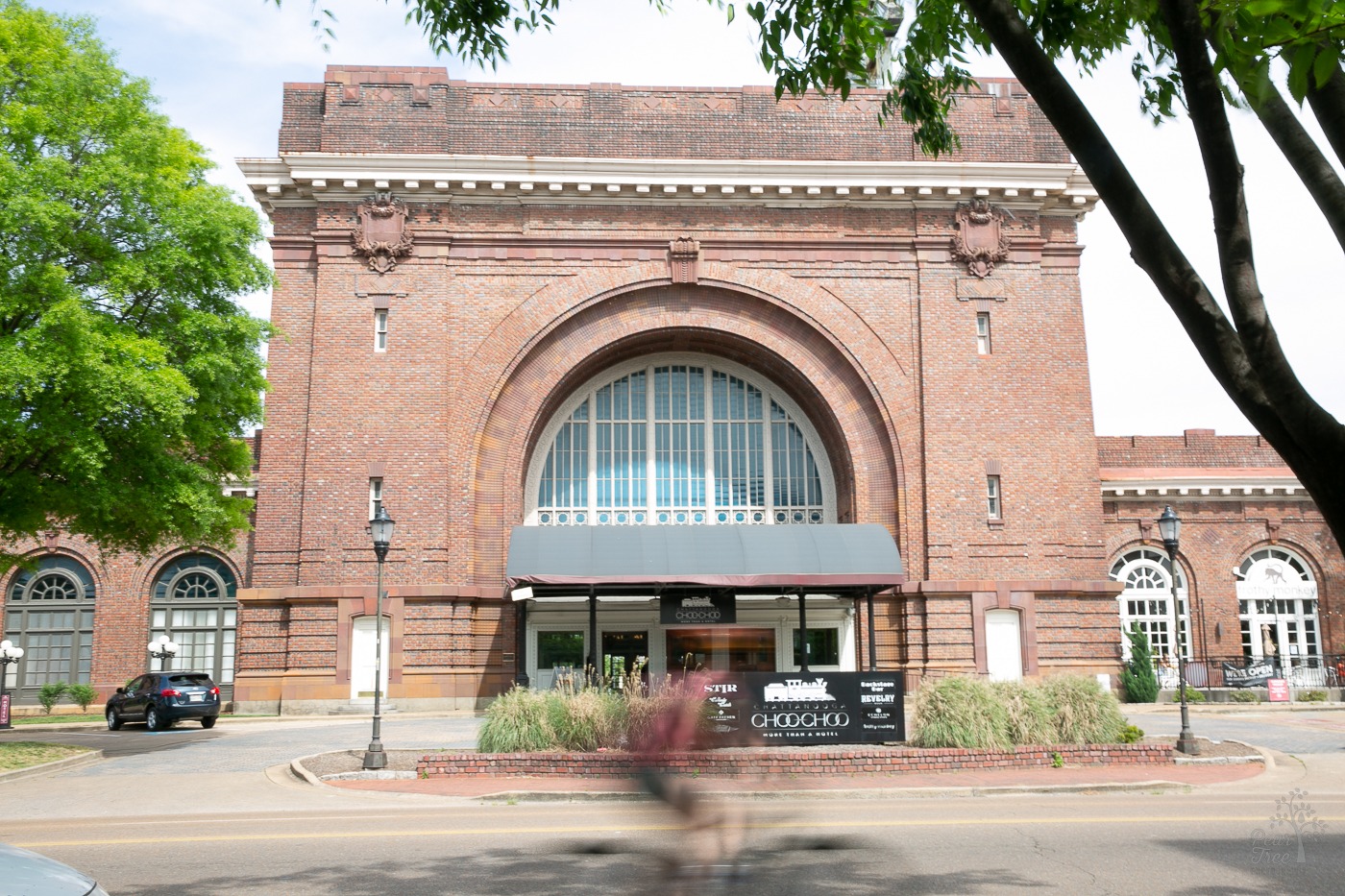 Front of Chattanooga Choo Choo hotel with the blur of a biker riding past