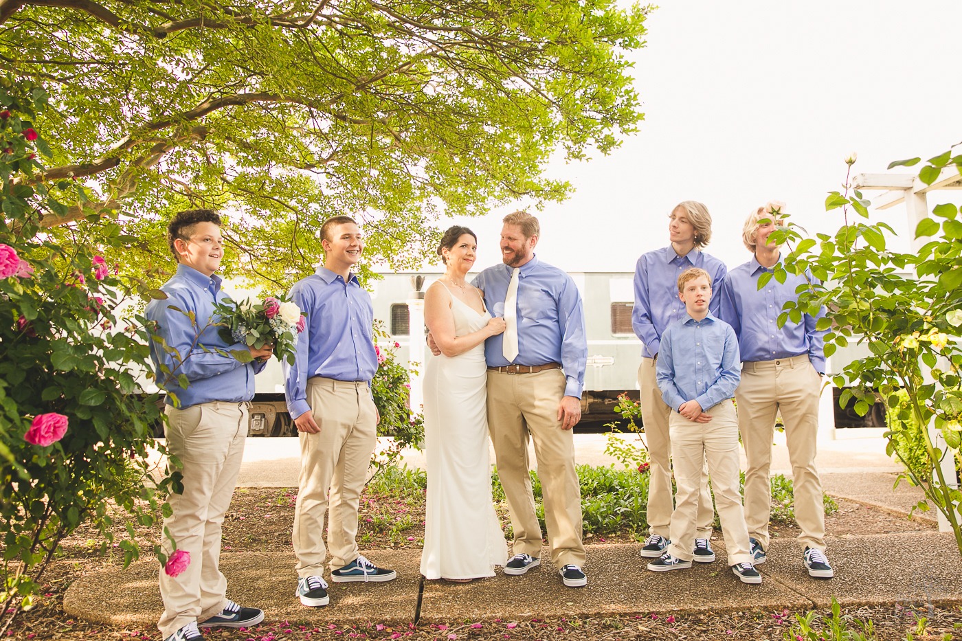 Bride making a funny face as Groom and their sons laugh during Chattanooga Choo Choo wedding ceremony