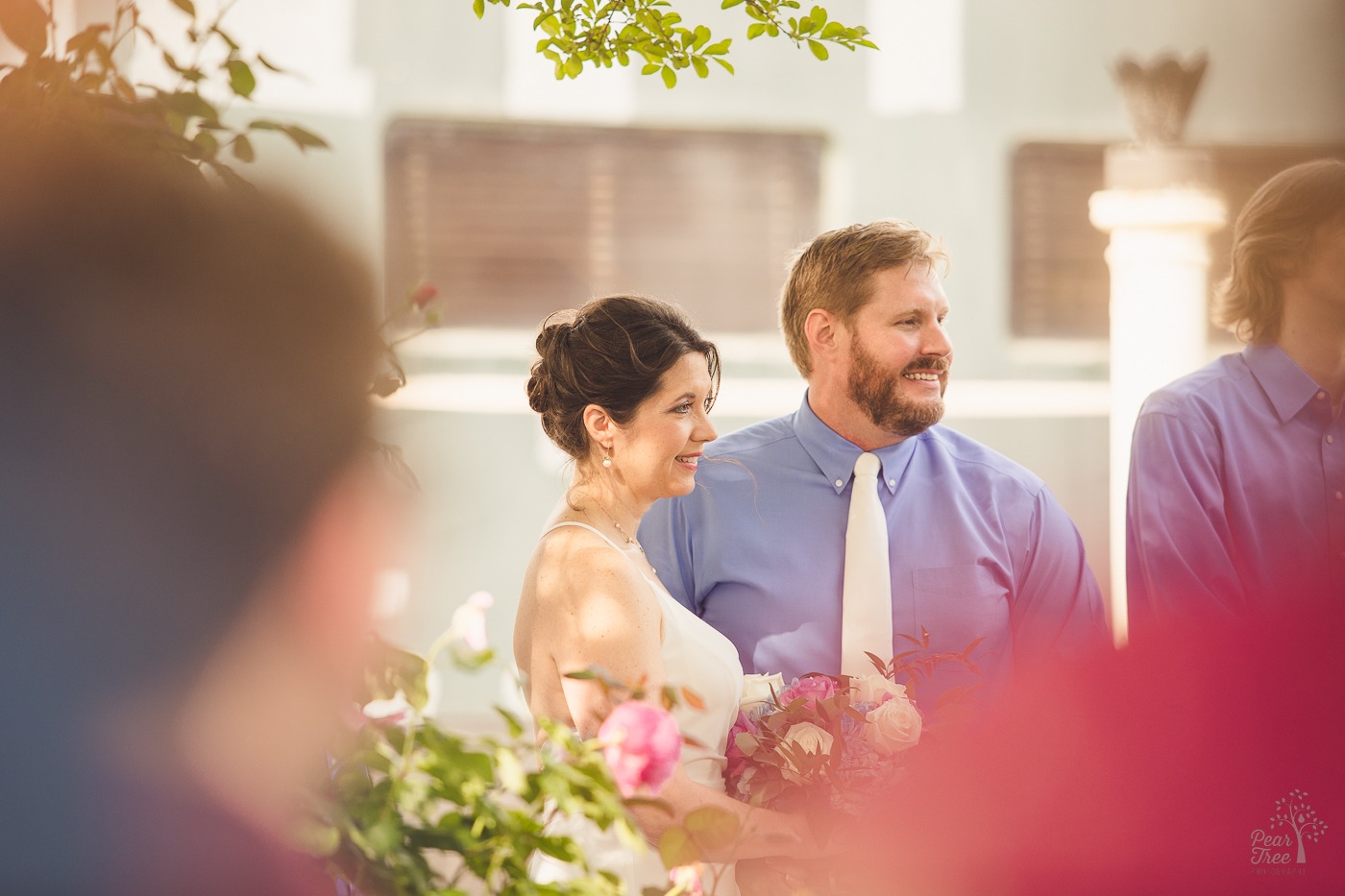 Bride and groom smiling during wedding ceremony