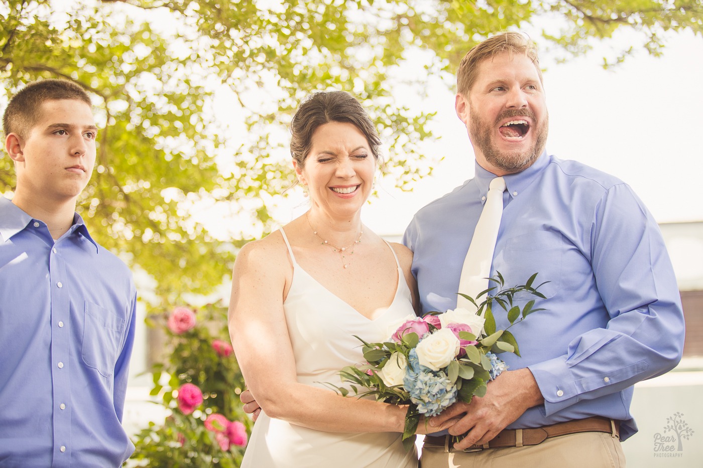 Bride and groom laughing during wedding ceremony