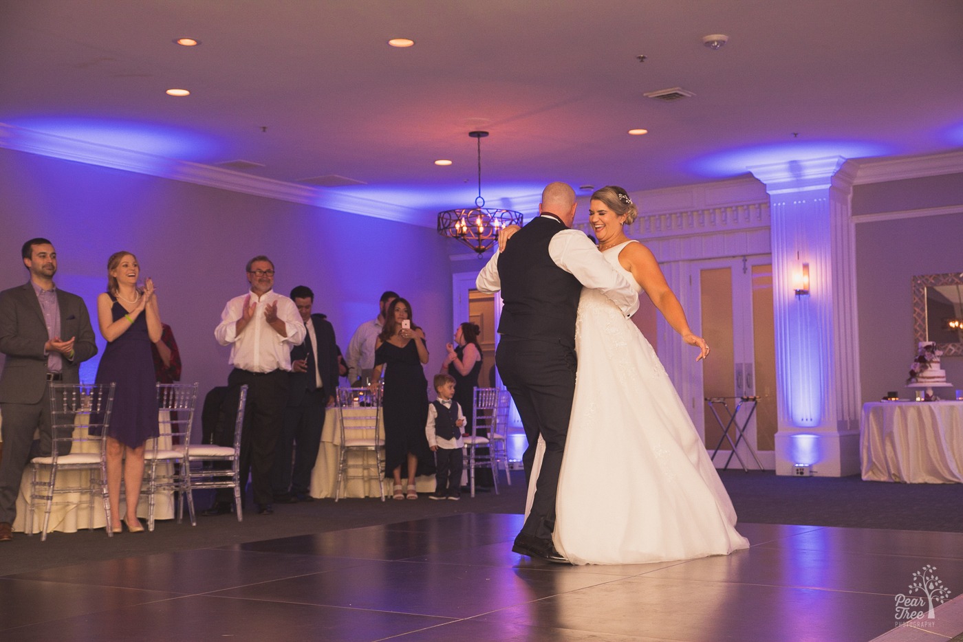 Bride and groom dancing and having fun on the dance floor