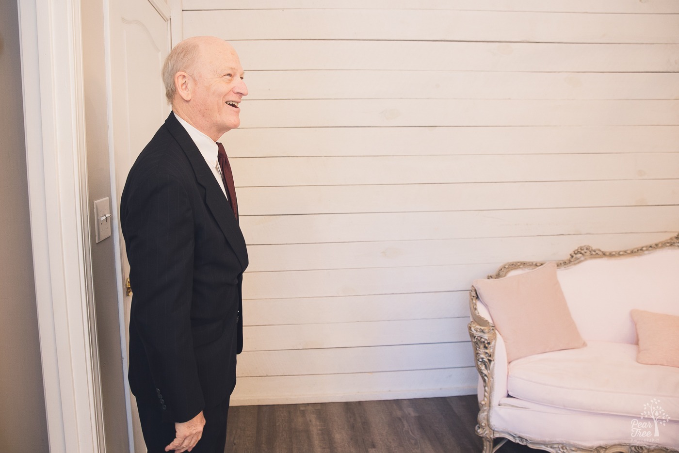 Father of the bride reacting to seeing his daughter dressed on her wedding day