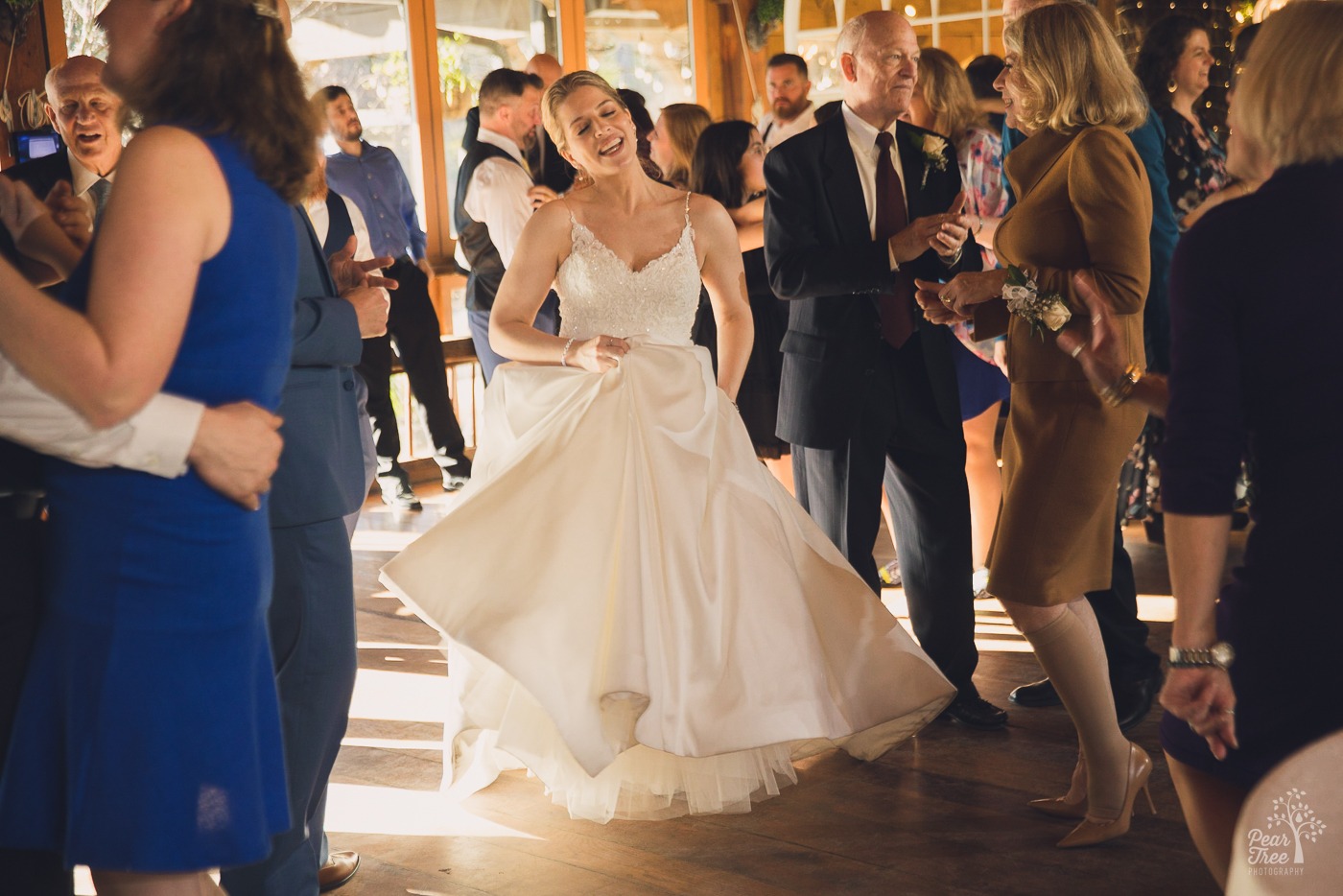 Bride dancing and singing on the dance floor