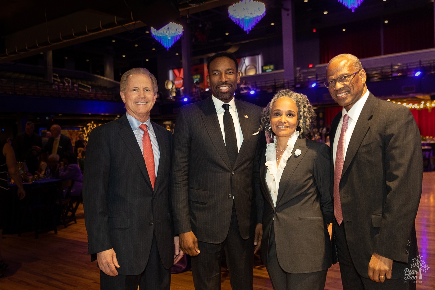 David Homrich, Atlanta Mayor Andre Dickens, Dr. Alie Redd, and Egbert Perry standing inside the Coca Cola Roxy smiling together during NOBS 2023.