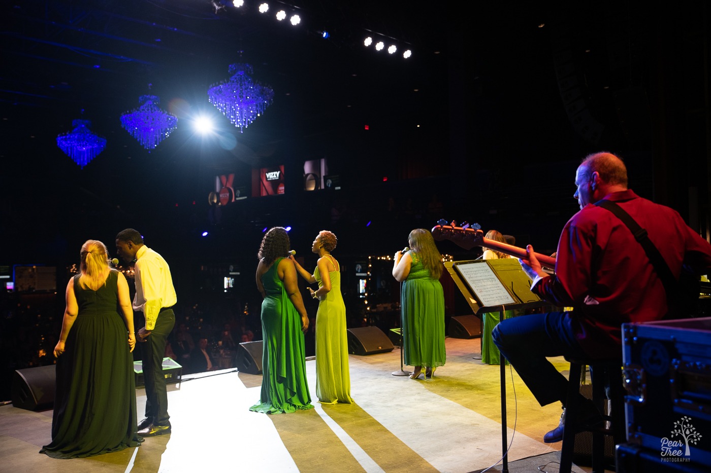 Backstage view at Coca Cola Roxy of Covenant House Georgia youth performing for an audience of hundreds