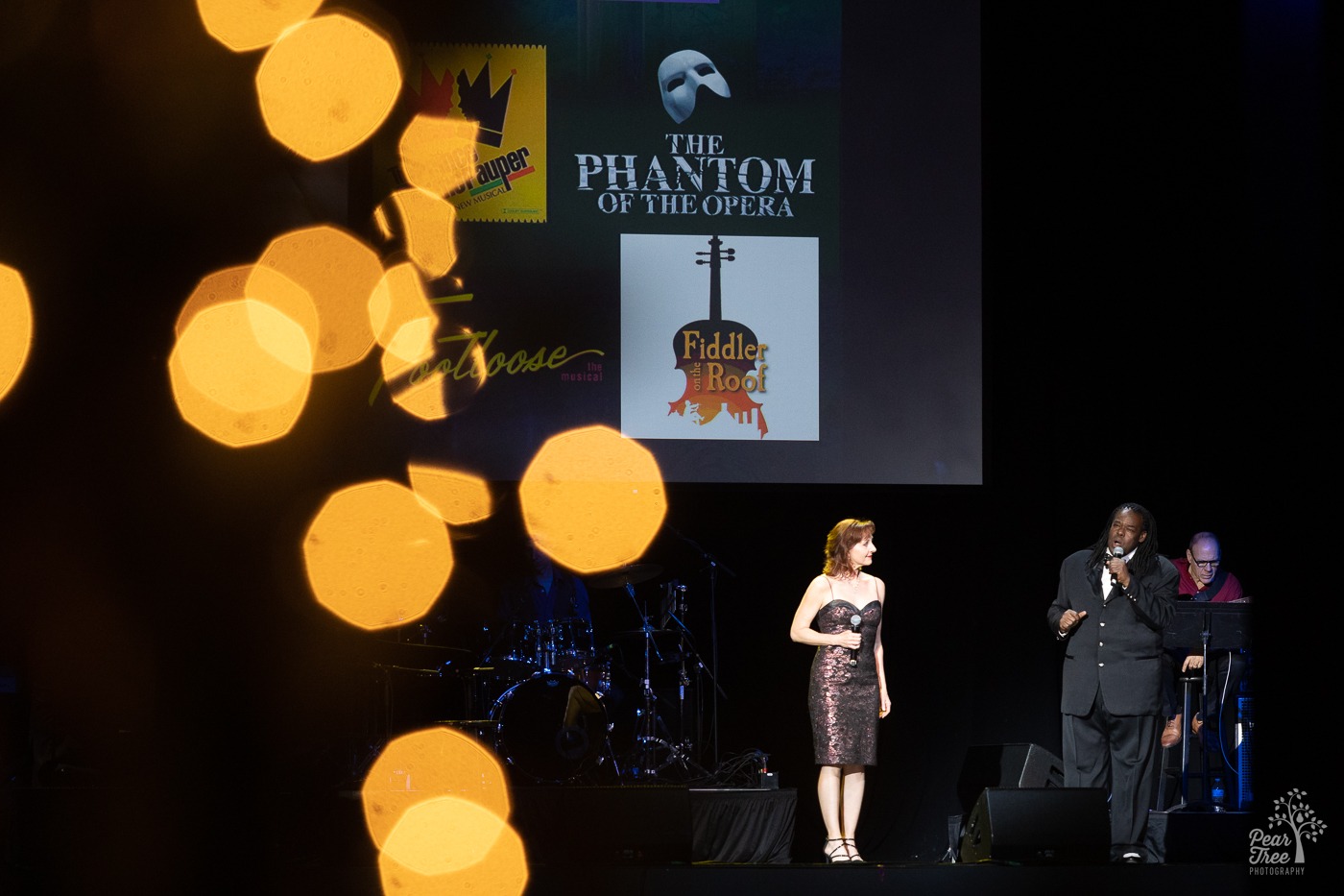 Broadway stars Rita Harvey and Roosevelt Credit performing onstage at the Coca Cola Roxy