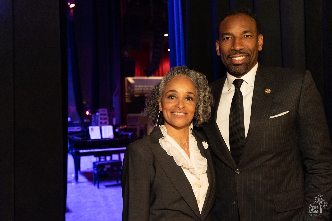 Dr. Alie Redd and Atlanta Mayor Andre Dickens standing together backstage at the Coca Cola Roxy