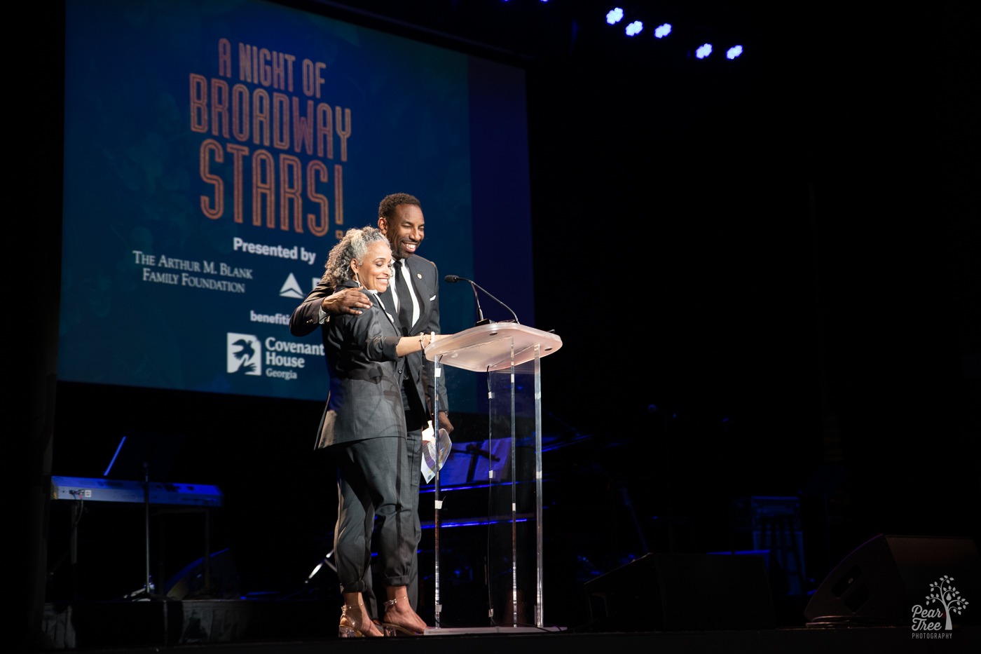 Atlanta Mayor Andre Dickens giving a side hug to Dr. Alie Redd at Night of Broadway Stars 2023