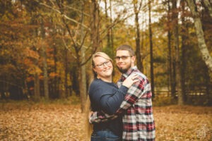 Foster parents making photographs together in the fall