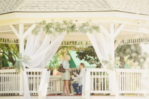 Downtown Woodstock gazebo decorated for a romantic proposal with rose petals and champage