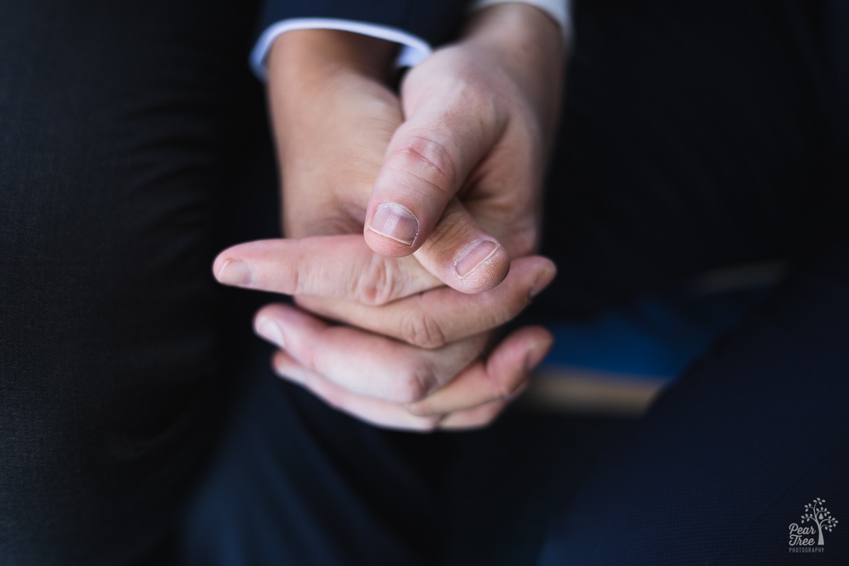 Two grooms holding each other's hand