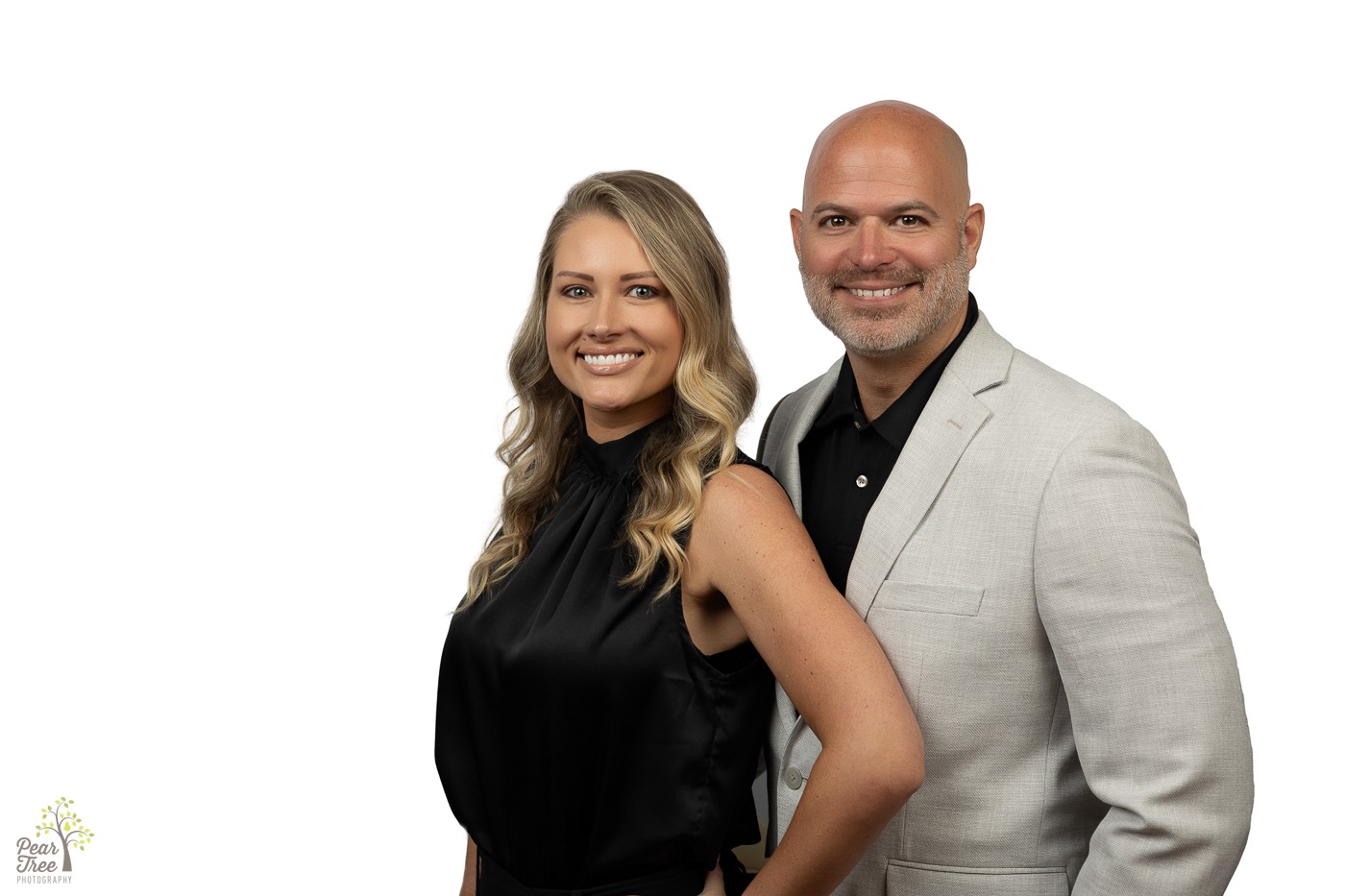 Local State Farm Agents Megan and Jeremy Green standing together smiling