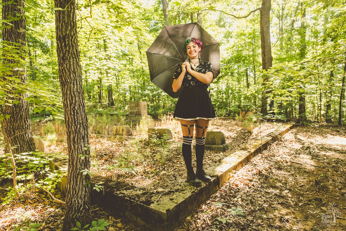 High school senior photographs on family property with a cemetery in the background