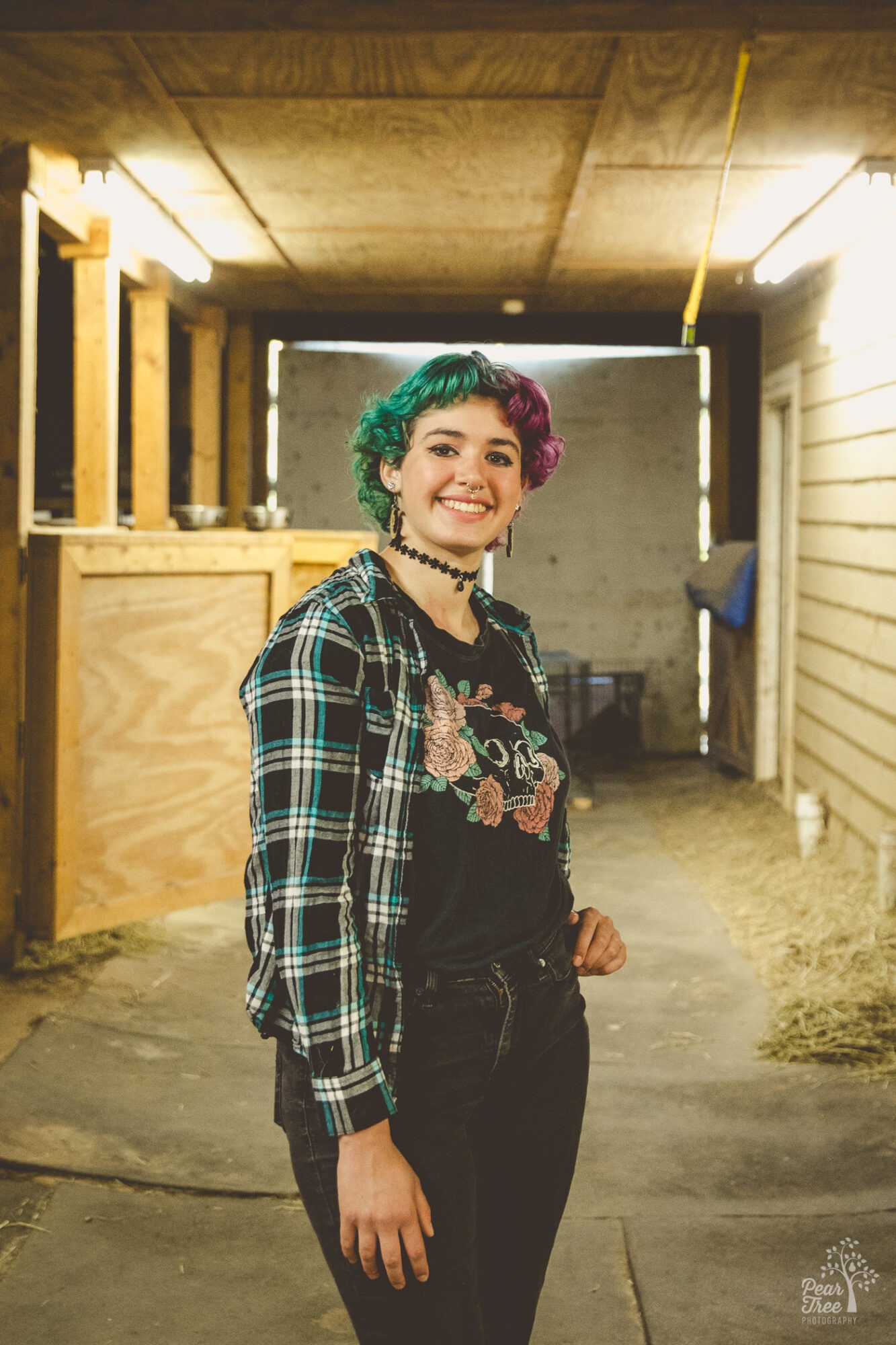 Adairsville high school senior smiling inside a barn