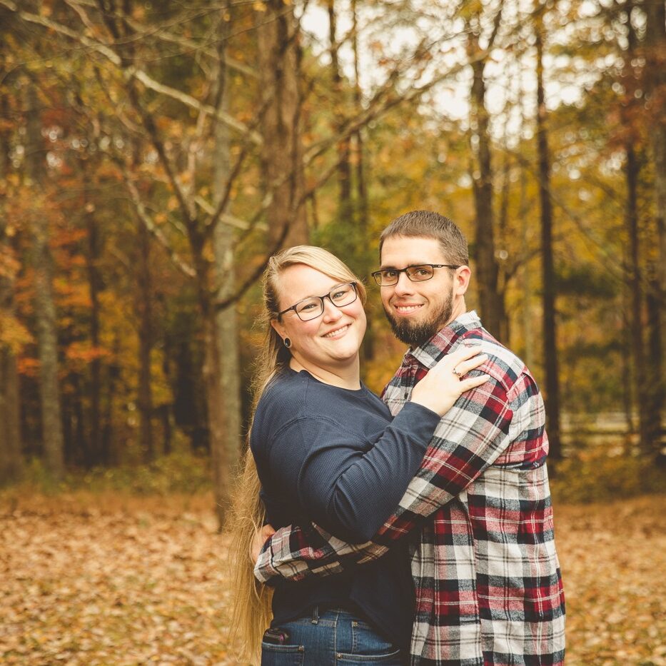 Foster parents making photographs together in the fall